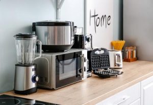 Kitchen appliances stacked in a kitchen table 