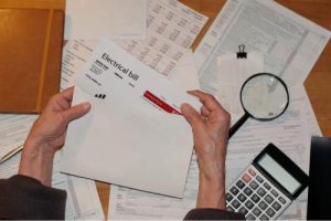 Bills and a calculator on a table 