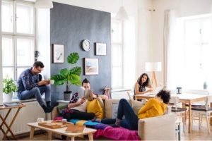 A group of students in the lounge area of a house