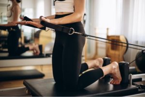 Girl doing reformer pilates